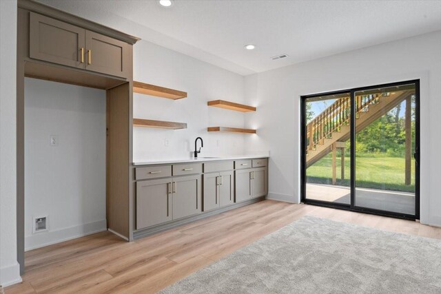 1112 2nd St NE, Altoona, IA 50009 - kitchen with gray cabinetry, light wood-style floors, a sink, open shelves, and recessed lighting