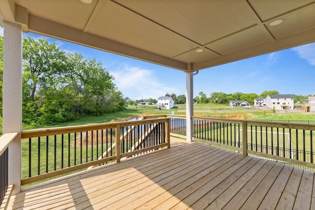 1112 2nd St NE, Altoona, IA 50009 - wooden terrace featuring a lawn and a water view