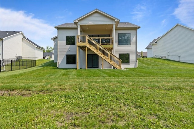 1112 2nd St NE, Altoona, IA 50009 - back of property featuring stairway and a wooden deck
