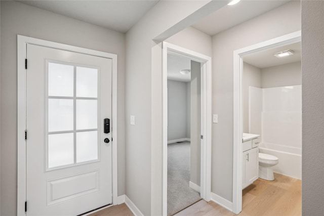 4413 NW Olivia Ln, Ankeny, IA 50023 - entryway with light wood-style floors and baseboards