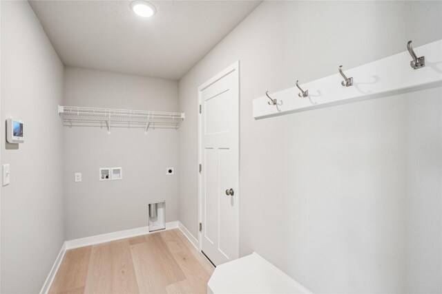 4413 NW Olivia Ln, Ankeny, IA 50023 - laundry area with light wood finished floors and hookup for a washing machine