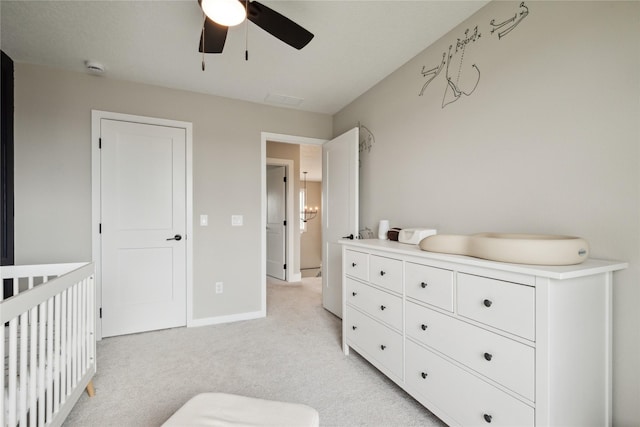70 NW Hidden Knl, Waukee, IA 50263 - bedroom featuring light colored carpet, baseboards, and a ceiling fan