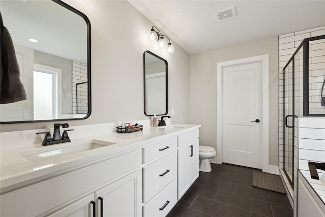 70 NW Hidden Knl, Waukee, IA 50263 - full bath featuring a stall shower, double vanity, tile patterned flooring, and toilet