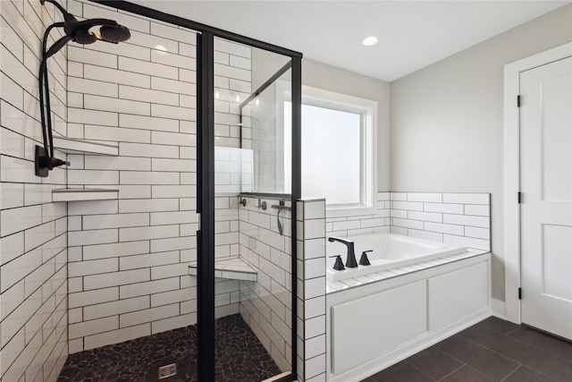 70 NW Hidden Knl, Waukee, IA 50263 - bathroom featuring a shower stall, a bath, and recessed lighting