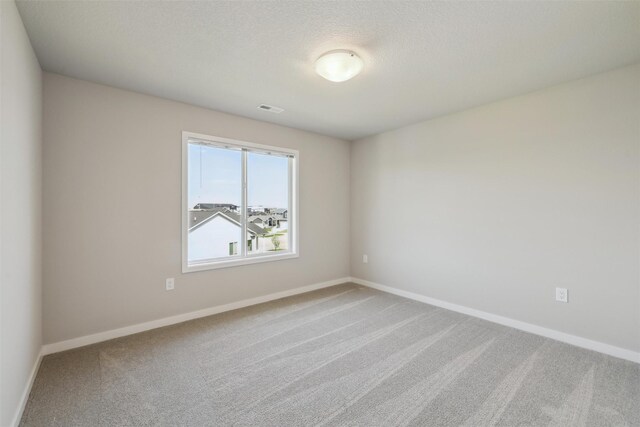 1715 Willow Ct, Norwalk, IA 50211 - spare room featuring baseboards and carpet floors