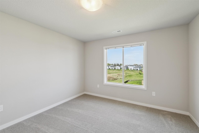 1715 Willow Ct, Norwalk, IA 50211 - carpeted spare room with baseboards and visible vents