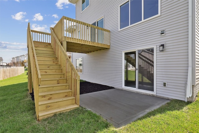 1715 Willow Ct, Norwalk, IA 50211 - rear view of house with a lawn, stairs, a patio area, and a deck