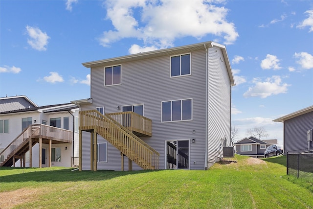1715 Willow Ct, Norwalk, IA 50211 - back of house with a yard, cooling unit, a wooden deck, and stairs