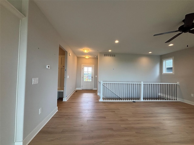 1910 Silver Maple Dr, Norwalk, IA 50211 - empty room featuring ceiling fan, baseboards, wood finished floors, and recessed lighting