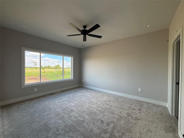 1910 Silver Maple Dr, Norwalk, IA 50211 - spare room with carpet floors, baseboards, and ceiling fan
