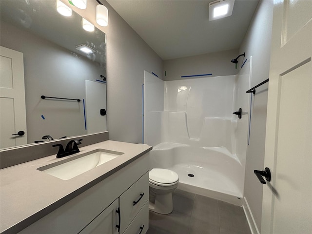 1910 Silver Maple Dr, Norwalk, IA 50211 - full bath with tile patterned floors, vanity, toilet, and a shower