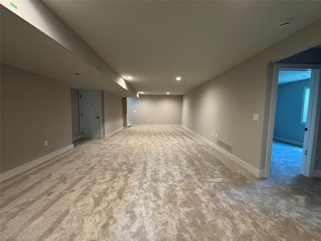 1910 Silver Maple Dr, Norwalk, IA 50211 - finished below grade area with light carpet, recessed lighting, and baseboards