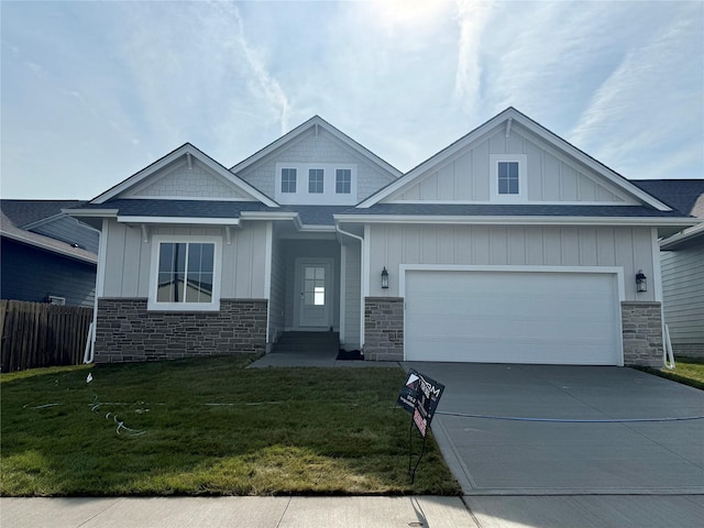 1910 Silver Maple Dr, Norwalk, IA 50211 - craftsman house with stone siding, driveway, board and batten siding, a garage, and roof with shingles