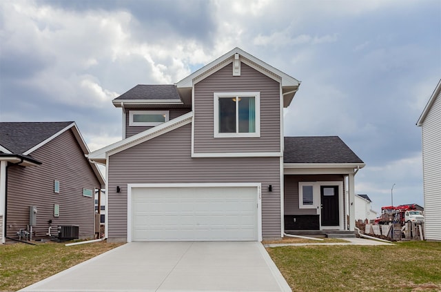 4125 NE 6th St, Ankeny, IA 50021 - view of front facade featuring a shingled roof, an attached garage, cooling unit, a front lawn, and driveway