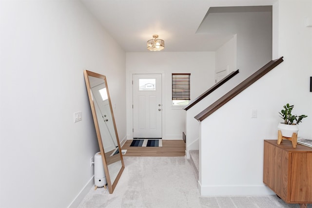 4125 NE 6th St, Ankeny, IA 50021 - entrance foyer with stairs, light carpet, and baseboards