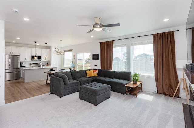 4125 NE 6th St, Ankeny, IA 50021 - living room with ceiling fan, recessed lighting, and light wood-style floors