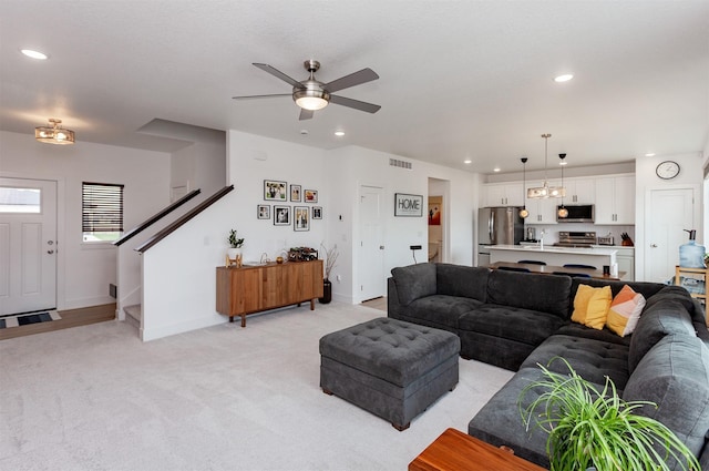 4125 NE 6th St, Ankeny, IA 50021 - living room with ceiling fan, light colored carpet, visible vents, recessed lighting, and baseboards