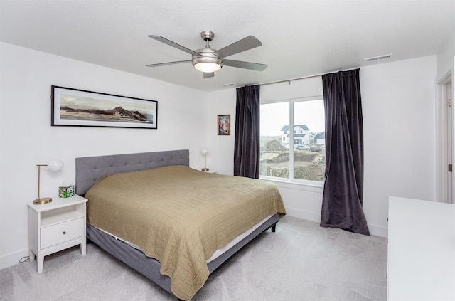 4125 NE 6th St, Ankeny, IA 50021 - bedroom with visible vents, light colored carpet, baseboards, and ceiling fan