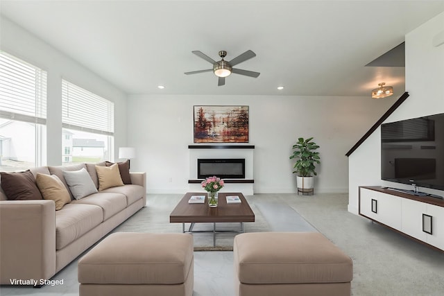 4125 NE 6th St, Ankeny, IA 50021 - living area with a ceiling fan, recessed lighting, a glass covered fireplace, and baseboards