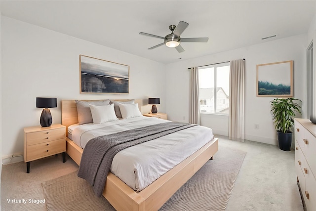 4125 NE 6th St, Ankeny, IA 50021 - bedroom with light colored carpet, baseboards, and ceiling fan
