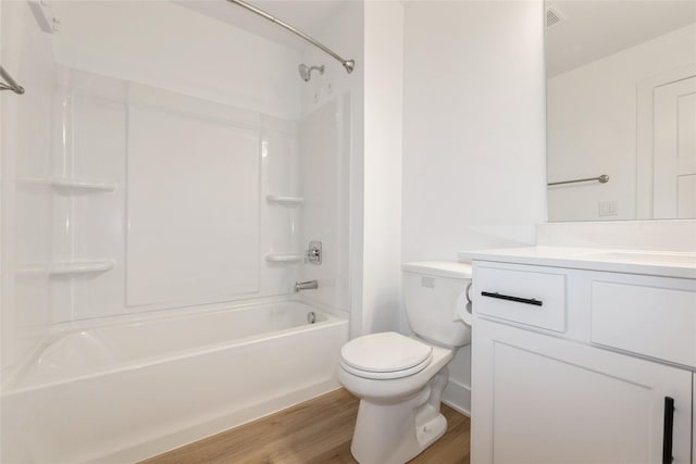 4125 NE 6th St, Ankeny, IA 50021 - full bathroom featuring wood finished floors, vanity, toilet, and  shower combination