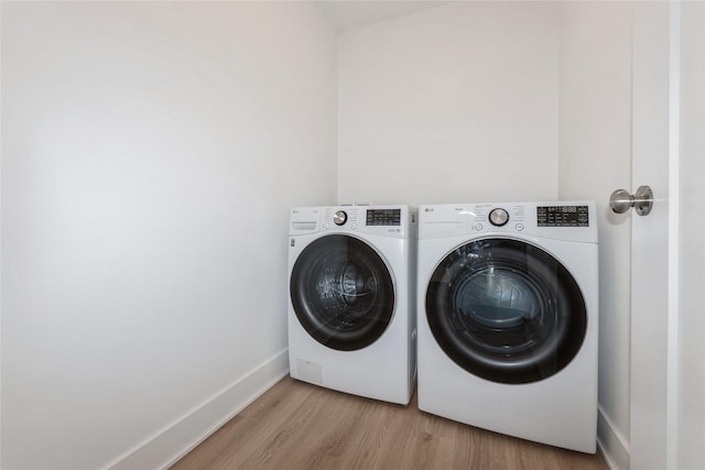 4125 NE 6th St, Ankeny, IA 50021 - laundry area featuring washer and clothes dryer, light wood-style flooring, and baseboards