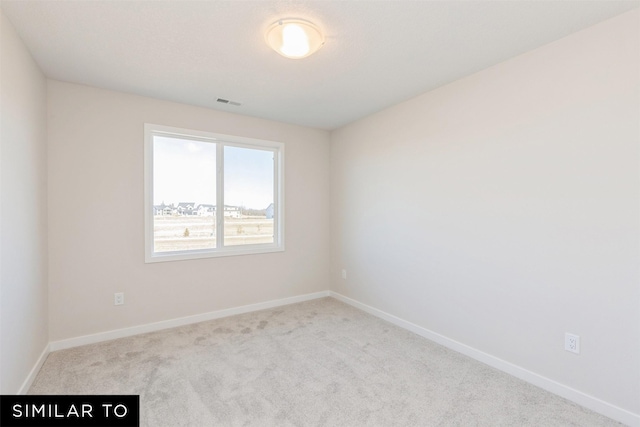6511 NE George Ave, Pleasant Hill, IA 50327 - carpeted empty room featuring baseboards