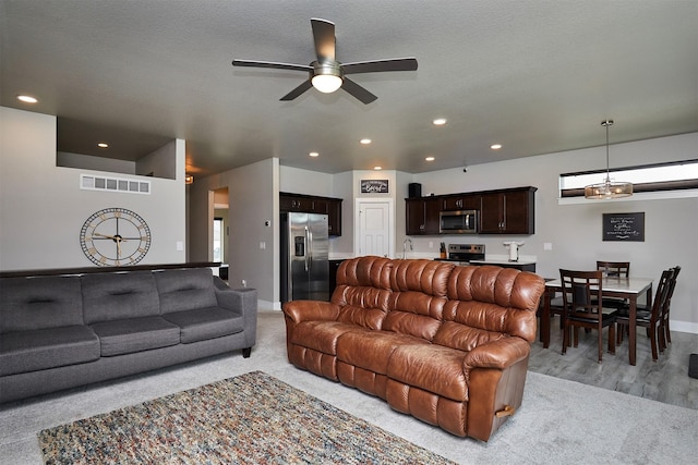 living room featuring recessed lighting, visible vents, baseboards, and ceiling fan