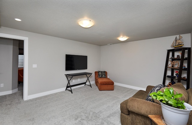 sitting room with carpet floors and baseboards