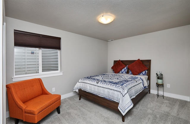 carpeted bedroom featuring baseboards