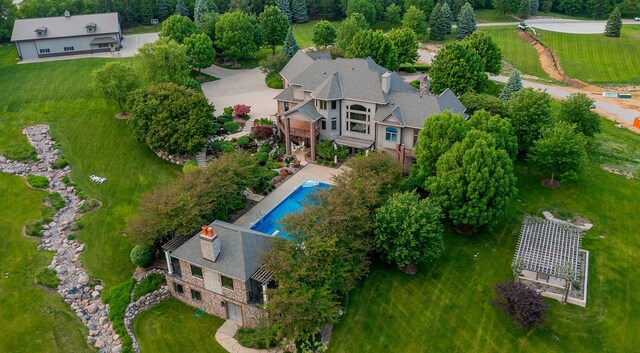 7580 NW 100th St, Johnston, IA 50131 - aerial view of property and surrounding area featuring a pool area