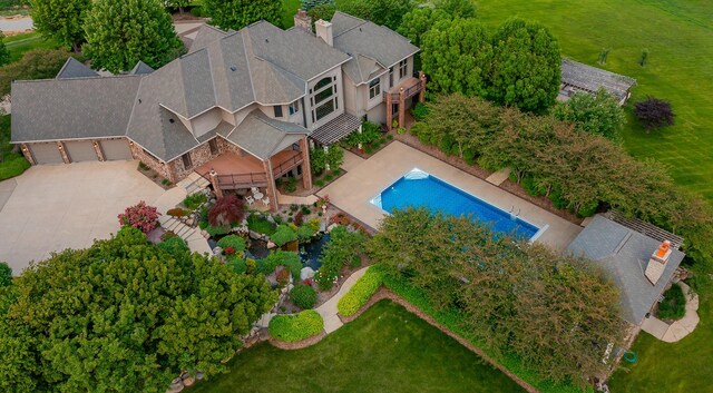7580 NW 100th St, Johnston, IA 50131 - view from above of property featuring a pool