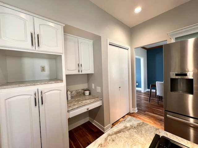 2501 Ridgewood Dr, West Des Moines, IA 50265 - kitchen featuring white cabinets, light wood-style flooring, baseboards, and stainless steel fridge with ice dispenser