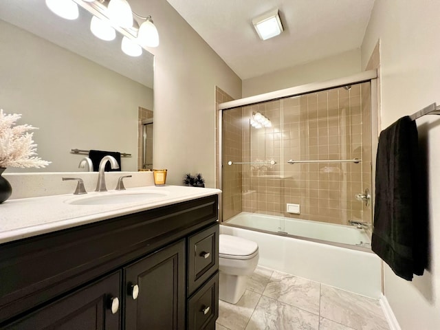 2501 Ridgewood Dr, West Des Moines, IA 50265 - bathroom with marble finish floor, combined bath / shower with glass door, toilet, and vanity