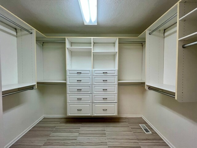 2501 Ridgewood Dr, West Des Moines, IA 50265 - walk in closet featuring visible vents