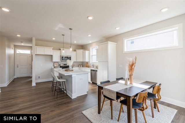 4215 NE 3rd St, Ankeny, IA 50021 - dining space with baseboards, recessed lighting, and dark wood-style floors