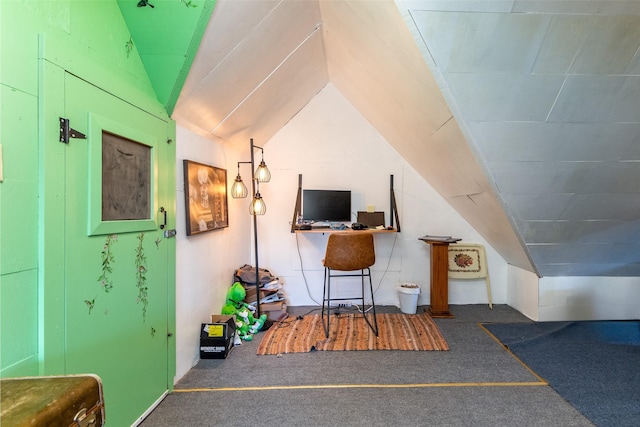 interior space with carpet and vaulted ceiling