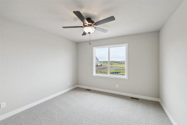 4421 NW Olivia Ln, Ankeny, IA 50023 - empty room with light carpet, baseboards, and a ceiling fan