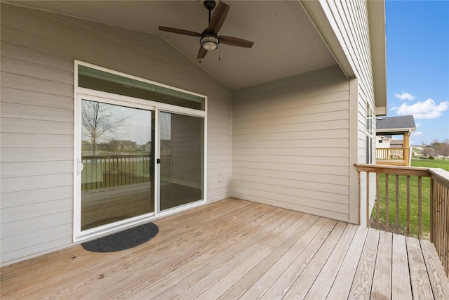 wooden deck with a ceiling fan