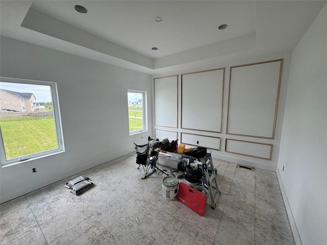 850 NW Frescott Cir, Waukee, IA 50263 - bedroom featuring a tray ceiling and baseboards