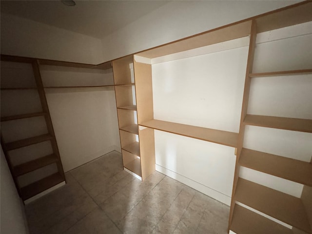850 NW Frescott Cir, Waukee, IA 50263 - spacious closet featuring tile patterned floors