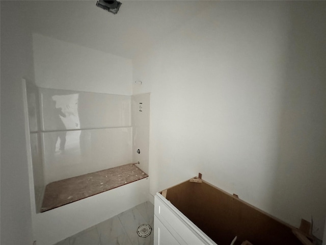 850 NW Frescott Cir, Waukee, IA 50263 - bathroom featuring marble look tile flooring