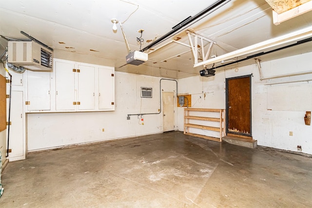 garage with electric panel, a garage door opener, and a heating unit