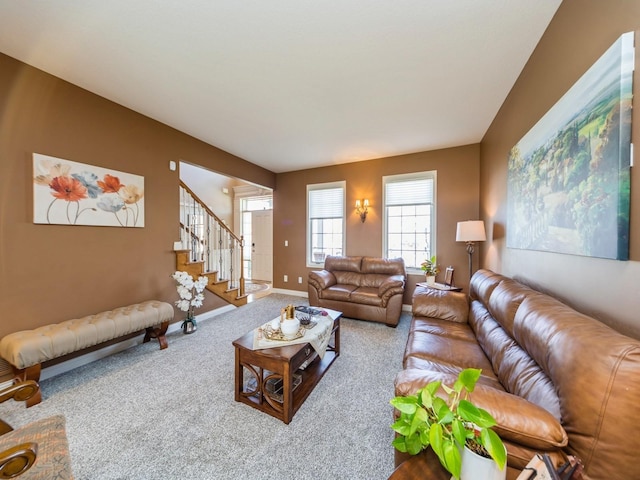 2705 147th St, Urbandale, IA 50323 - carpeted living room featuring baseboards and stairs