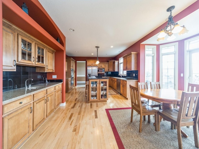 2705 147th St, Urbandale, IA 50323 - dining room featuring baseboards, recessed lighting, and light wood-type flooring