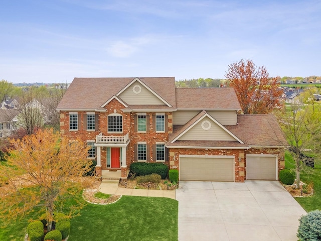 2705 147th St, Urbandale, IA 50323 - view of front facade featuring a front lawn, roof with shingles, an attached garage, driveway, and brick siding