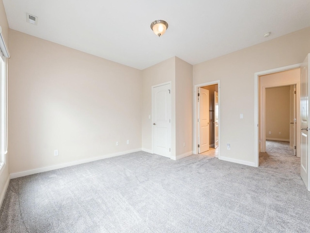 2705 147th St, Urbandale, IA 50323 - unfurnished bedroom with light carpet and baseboards