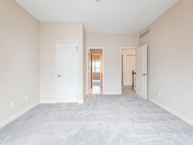 2705 147th St, Urbandale, IA 50323 - unfurnished bedroom featuring light colored carpet and baseboards