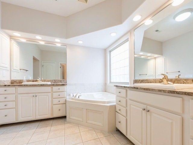2705 147th St, Urbandale, IA 50323 - full bath featuring two vanities, tile patterned flooring, a bath, and recessed lighting