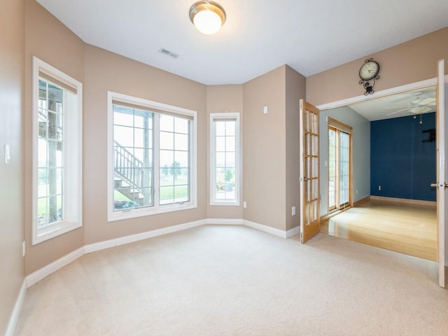 2705 147th St, Urbandale, IA 50323 - unfurnished room with carpet flooring and ceiling fan